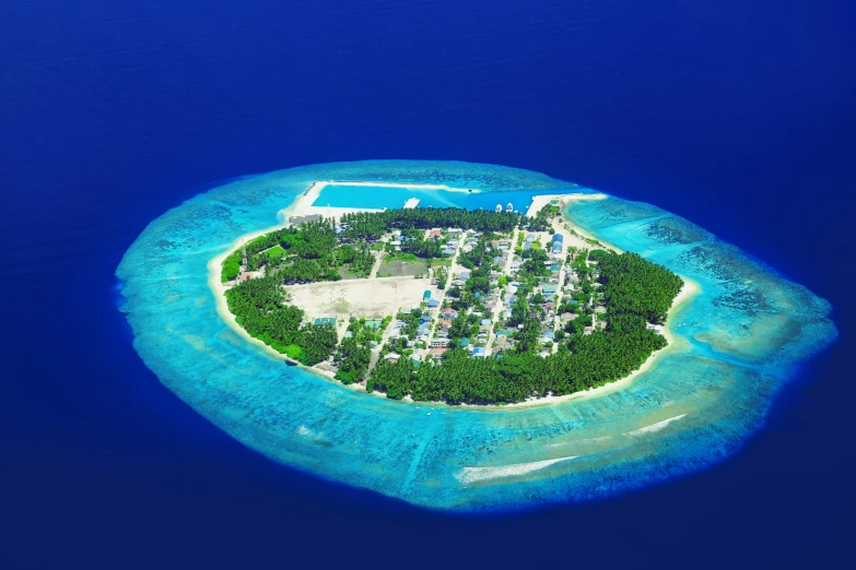 a small island in the middle of the ocean, pexels contest winner, hurufiyya, neighborhood, maldives in background, slide show, o'neill cylinder colony