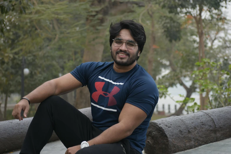 a man sitting on top of a wooden bench, a portrait, inspired by Saurabh Jethani, pexels contest winner, hurufiyya, avatar image, half body photo, thicc, headshot profile picture