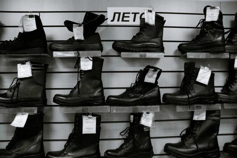 a black and white photo of a display of boots, a black and white photo, pexels, neoism, sanctions in russia, vantablack wall, inventory item, thumbnail