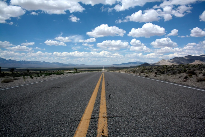 an empty road in the middle of the desert, by Dennis Ashbaugh, unsplash, photorealism, 2 5 6 x 2 5 6 pixels, big sky, broadway, national geograph