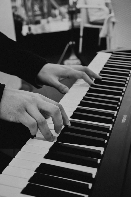 a close up of a person playing a piano, a black and white photo, by Felix-Kelly, 🪔 🎨;🌞🌄, yusuke murata and junji ito, uploaded, normal hands