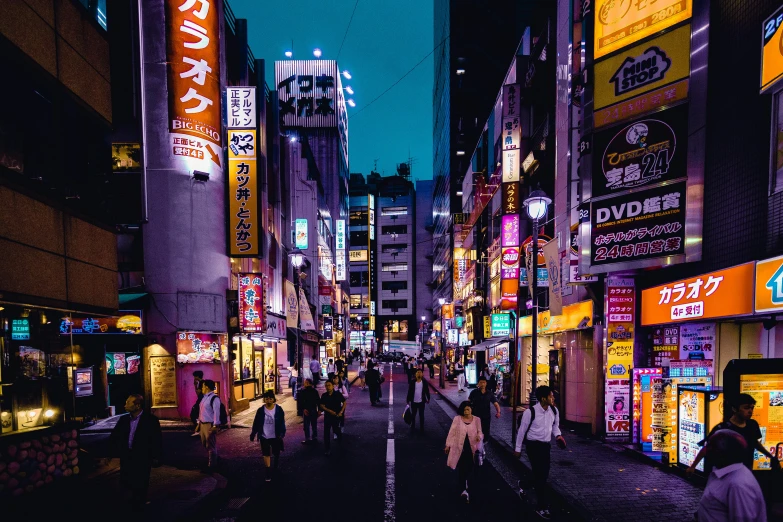 a group of people walking down a street at night, a photo, pexels contest winner, ukiyo-e, colorful signs, down-town, 80s photo, european japanese buildings