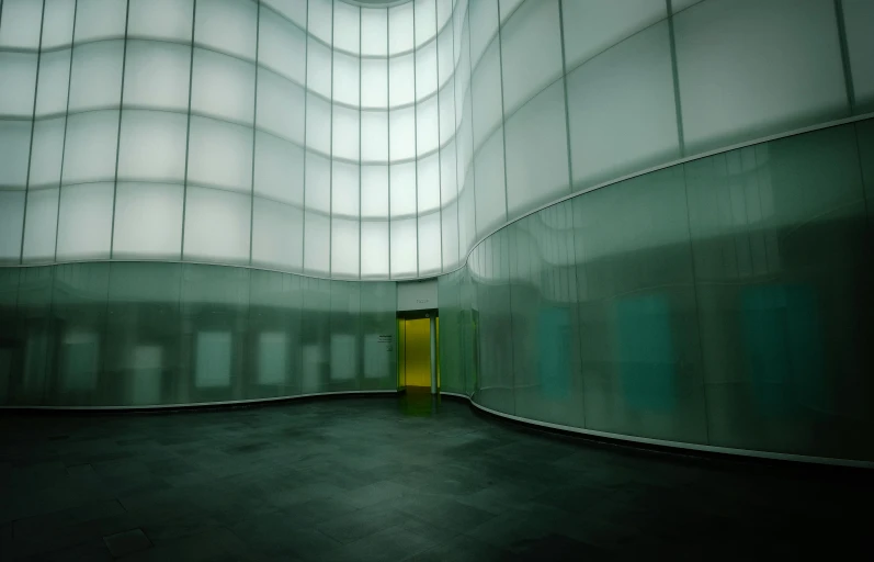 a large glass building with a yellow door, flickr, light and space, claustrophobic room, sinuous, square, foggy room