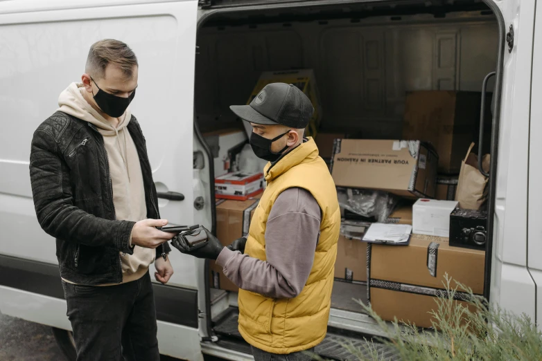a couple of men standing next to a van, scanning items with smartphone, finely masked, profile image, jovana rikalo