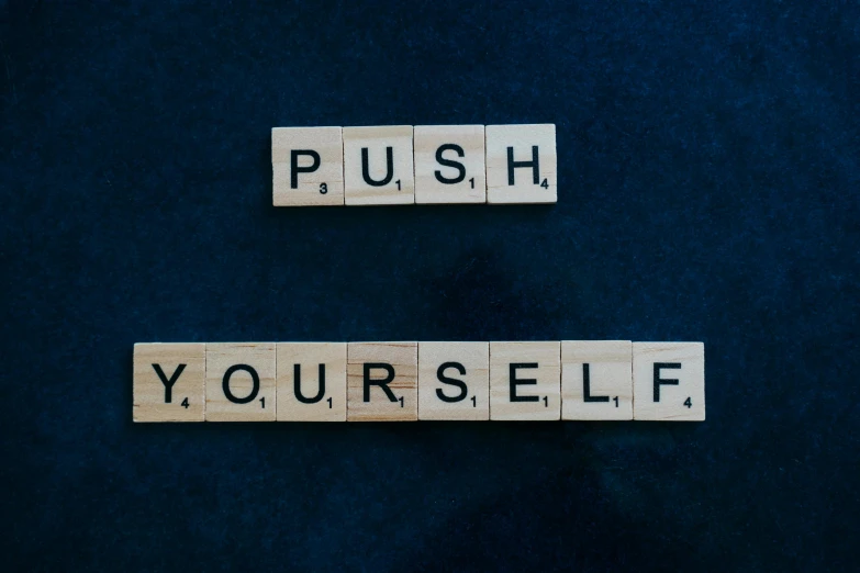 two scrabbles spelling push yourself and yourself, by Julia Pishtar, unsplash, profile pic, paul carrick, guide, self - confidence