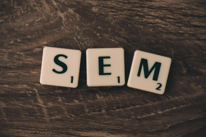 the word seo spelled in scrabbles on top of a wooden table, by Adam Szentpétery, unsplash, modernism, square, ceramic, megaman, 24mm