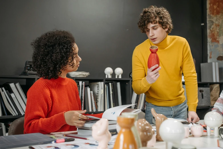 a group of people sitting around a table, trending on pexels, arbeitsrat für kunst, wearing a red turtleneck sweater, inspect in inventory image, medium shot of two characters, student