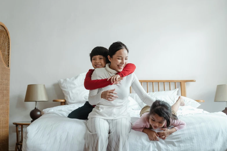 a woman sitting on top of a bed next to a little girl, kids playing, multiple arms, manuka, mama i need wife