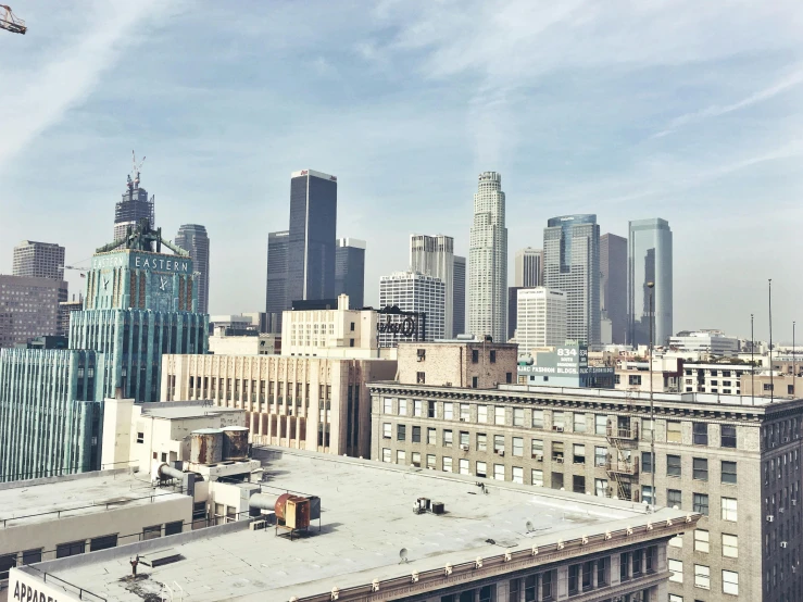 a view of a city from the top of a building, a photo, inspired by L. A. Ring, unsplash contest winner, brutalism, skyline view from a rooftop, grain”, hyperrealism”, background image
