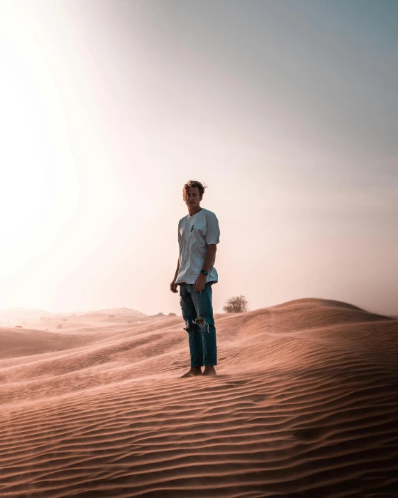 a man standing in the middle of a desert, pexels contest winner, lgbtq, with instagram filters, intimidating floating sand, chillhop