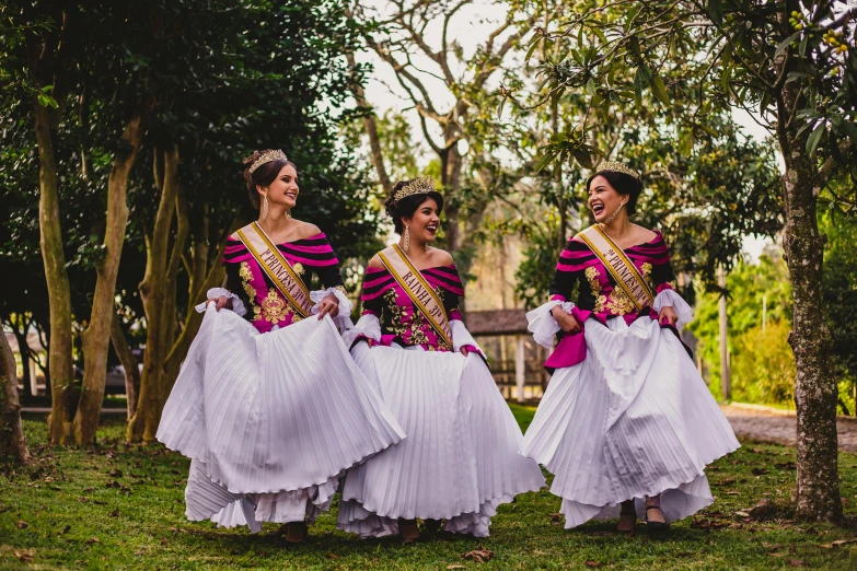 a group of women standing on top of a lush green field, an album cover, pexels contest winner, baroque, folklorico, sukhothai costume, prima ballerina in rose garden, a purple and white dress uniform