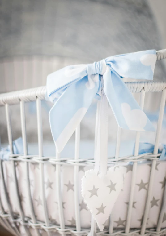 a white wicker basket with a blue bow, instagram, star born, pale cyan and grey fabric, detail shot, large