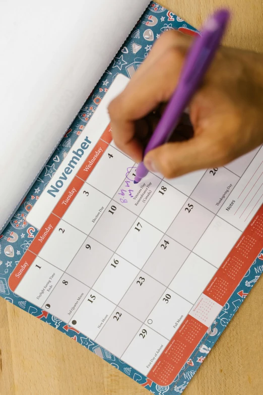 a person writing on a calendar with a purple pen, inspired by Benjamin Franklin, happening, vibrant patterns, thumbnail, detail shot, full product shot