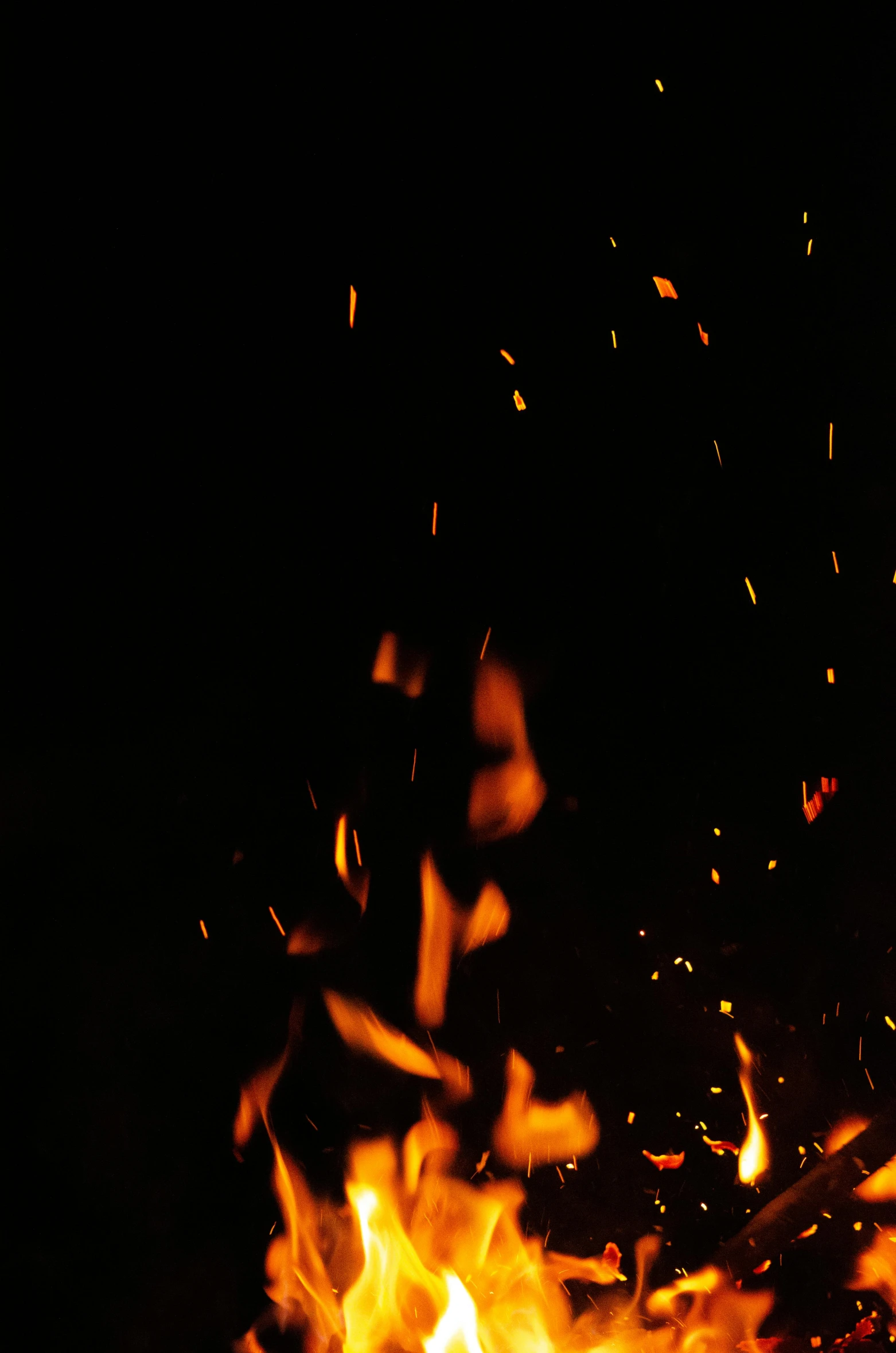 a fire with lots of sparks coming out of it, pexels, grainy footage, cinematic shot ar 9:16 -n 6 -g, high quality photo, fire texture