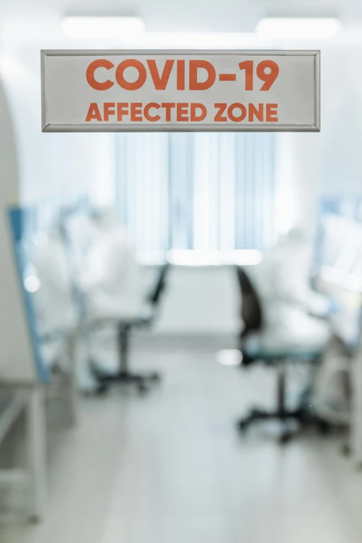 a room with chairs and a sign that says covidid - 19 affected zone, shutterstock, altermodern, sitting at desk at keyboard, stood in a lab, blurred, clinically depressed