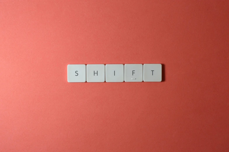 the word shift spelled in white tiles on a pink background, an album cover, by Sylvia Wishart, trending on unsplash, mechanical keyboard, red shift, thumbnail, half - turn