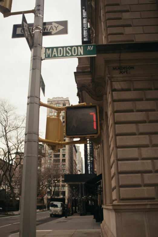 a traffic light sitting on the side of a street, an album cover, inspired by Nan Goldin, trending on unsplash, dada, on madison avenue, ( ( theatrical ) ), madison beer, signs