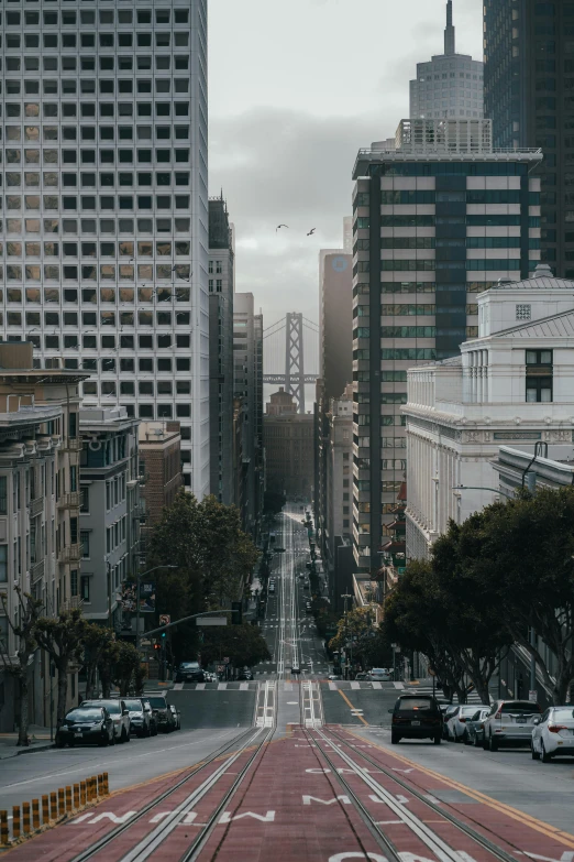 a street filled with lots of traffic next to tall buildings, pexels contest winner, modernism, sf, distant view, background image, all buildings on bridge