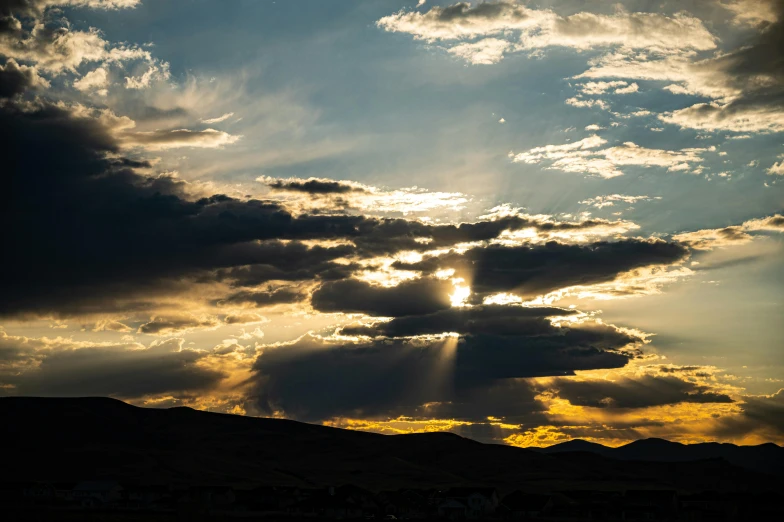 the sun is shining through the clouds in the sky, pexels contest winner, precisionism, wyoming, moody sunset background, multiple stories, late summer evening