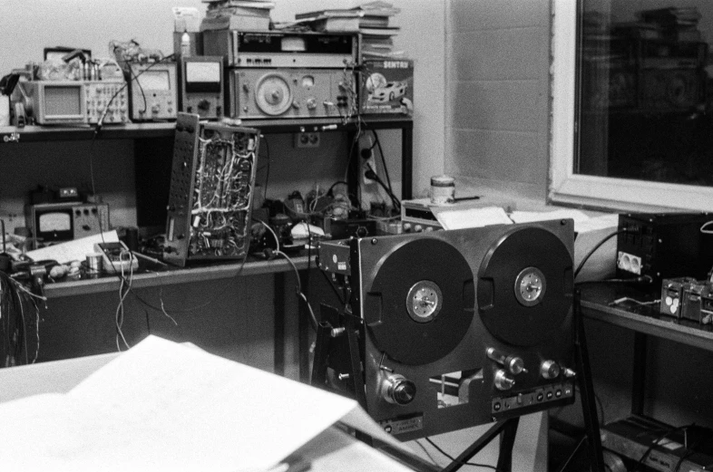 a black and white photo of a room full of electronics, by Glennray Tutor, tape deck, instrument, 2 0 0 2 photo