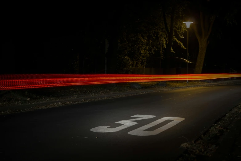 a street sign sitting on the side of a road, by Adam Marczyński, light trails, 5 0 years old, profile image, steps 50