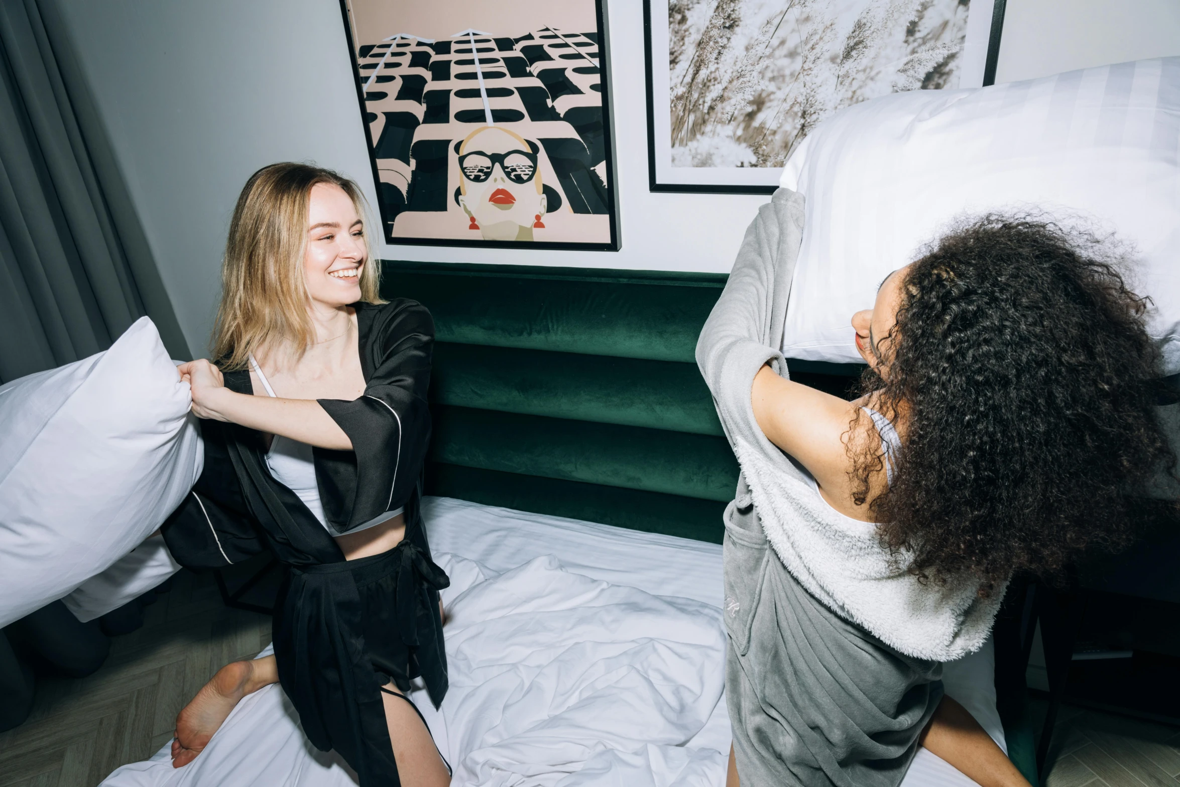 a couple of women standing next to each other on a bed, trending on unsplash, happening, college party, white and black clothing, swirling around, sydney sweeney