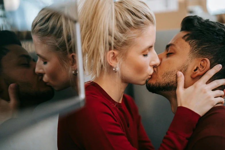 a man kissing a woman in front of a mirror, trending on pexels, short stubble, blonde, cuddly, lachlan bailey