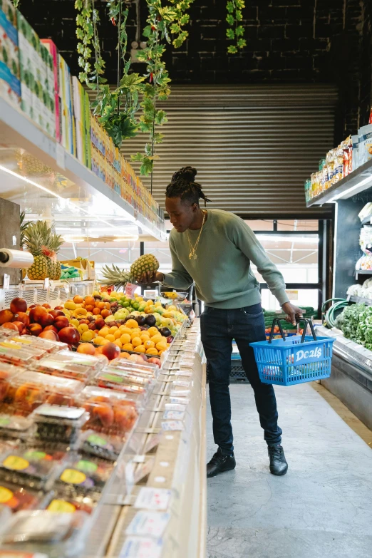 a woman is shopping in a grocery store, by Sam Dillemans, happening, young thug, fruit, sustainable, man walking