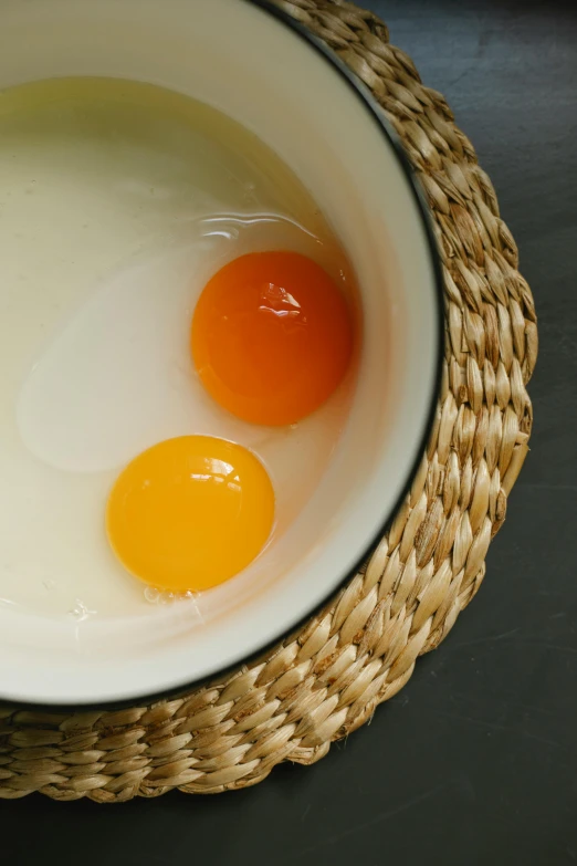 a bowl filled with eggs sitting on top of a table, detailed product image, rené laloux, cream, adult pair of twins