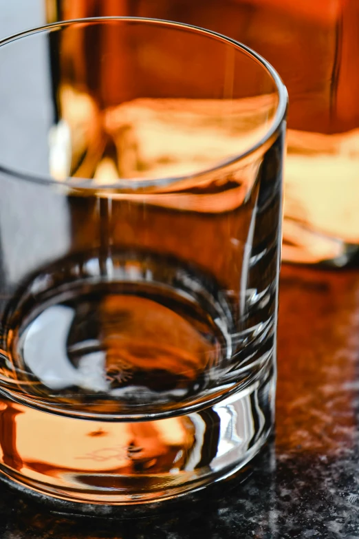 a glass of whiskey next to a bottle, pexels, renaissance, square rimmed glasses, full frame image, thumbnail, brown