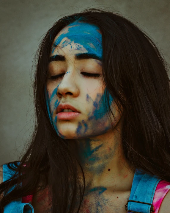 a woman with blue paint on her face, a colorized photo, trending on pexels, lgbt art, dreaming face, asian women, body paint