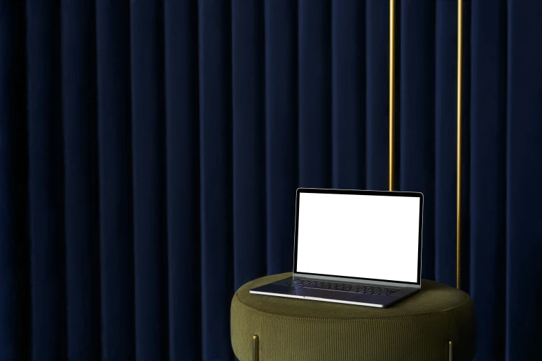 a laptop computer sitting on top of a stool, a computer rendering, inspired by Joseph Wright of Derby, trending on pexels, blue velvet, black vertical slatted timber, dark drapery, navy