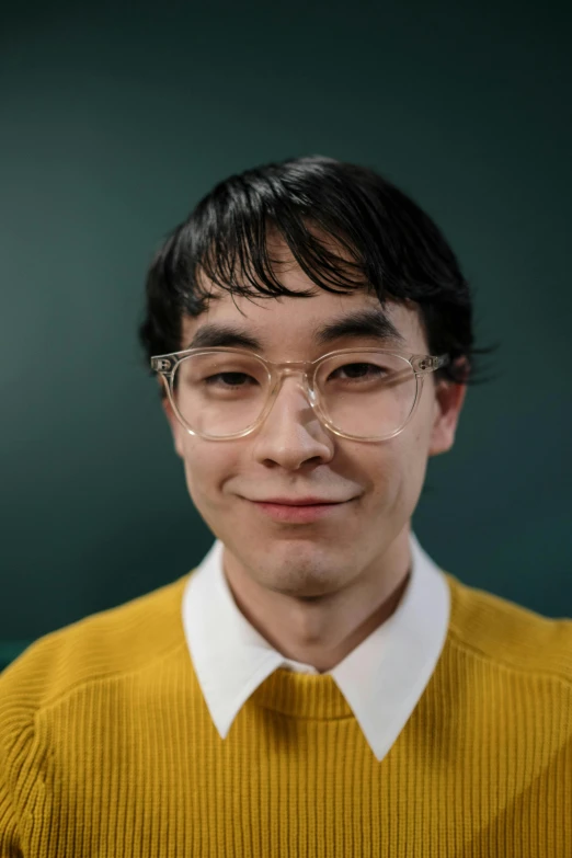 a man wearing glasses and a yellow sweater, inspired by Russell Dongjun Lu, reddit, an epic non - binary model, portrait mode photo, wide forehead, jody highroller