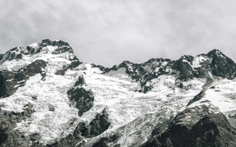 a black and white photo of a snow covered mountain, pexels contest winner, mountains of ice cream, new zealand, monochrome color, unsplash photography