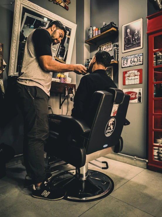 a man getting a haircut at a barber shop, by Adam Marczyński, pexels contest winner, les nabis, thumbnail, full body profile, sitting in chair, profile image