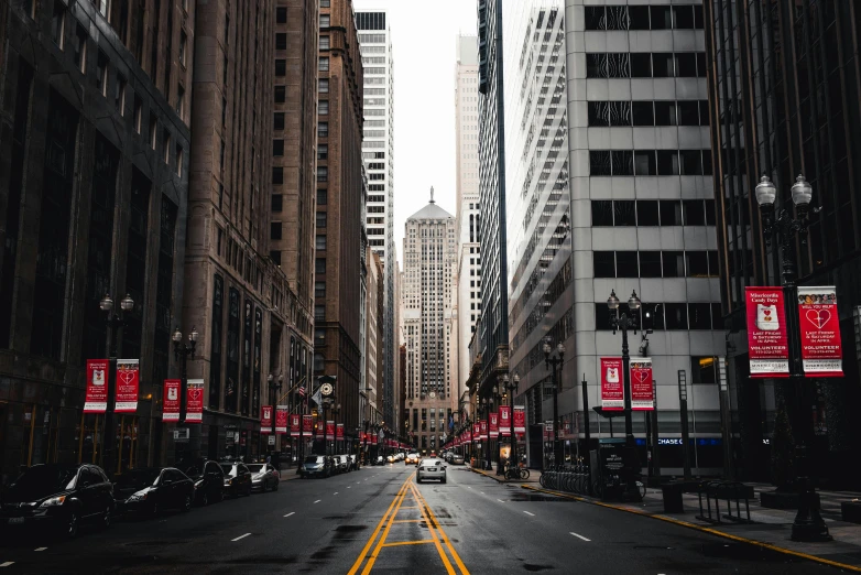 a city street filled with lots of tall buildings, inspired by Thomas Struth, pexels contest winner, hyperrealism, modern chicago streets, empty streetscapes, video, fan favorite