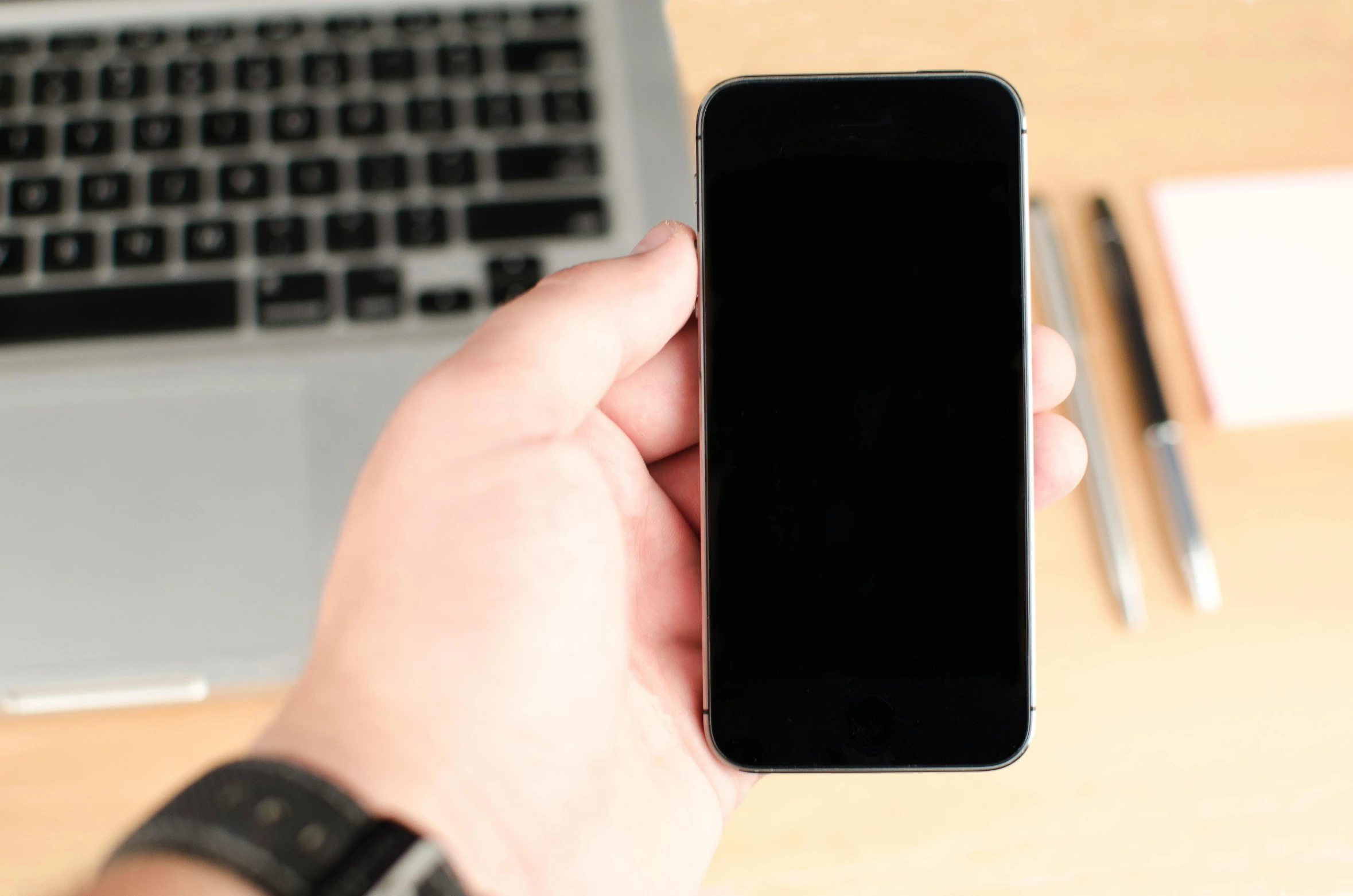 a person holding a cell phone in front of a laptop, pexels, tachisme, square, professional iphone photo, maintenance, simplistic