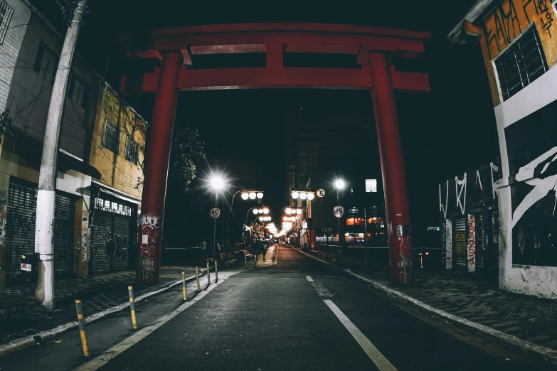 a red tori gate in the middle of a street, pexels contest winner, ukiyo-e, dark, black, ethnicity : japanese, electricity archs