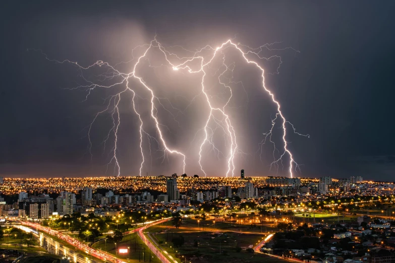 a lightning storm over a city at night, an album cover, by Joze Ciuha, pexels contest winner, buenos aires, electrical arcs, bolts, group photo