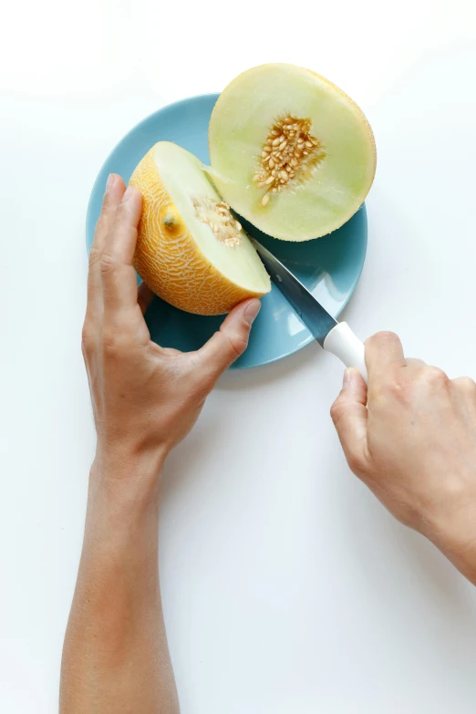 a person cutting a melon with a knife on a plate, a picture, trending on pexels, petite pear slim figure, about to consume you, digital image, gerit dou