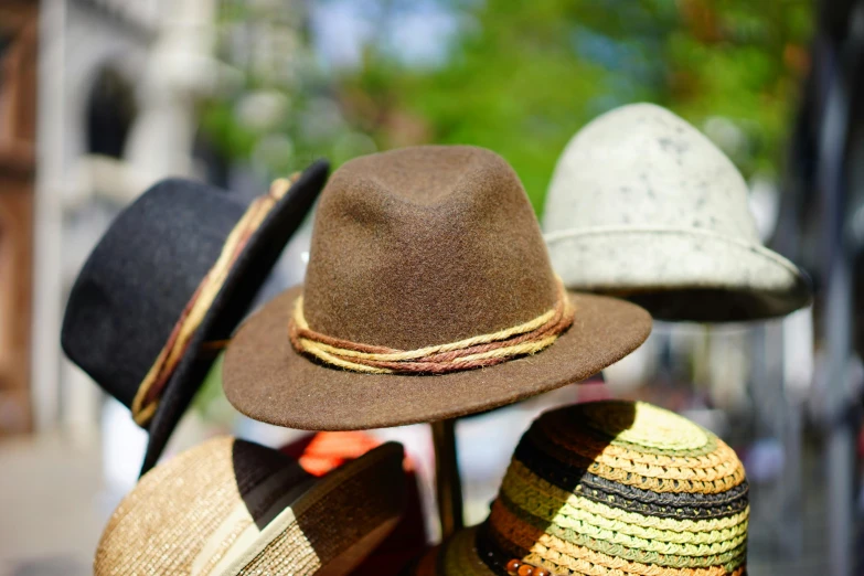 a group of hats sitting on top of each other, by Thomas Häfner, pexels, wearing a brown, avatar image, close - up photo, seasonal