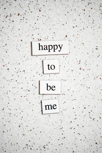 a piece of paper that says happy to be me, by Emma Andijewska, trending on unsplash, made of all white ceramic tiles, magnetic, 15081959 21121991 01012000 4k, full body image