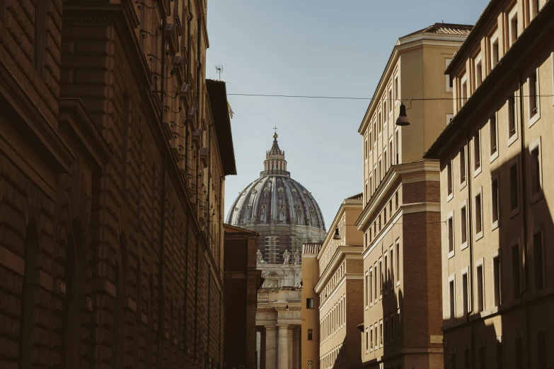 a group of people walking down a street next to tall buildings, by Cagnaccio di San Pietro, unsplash contest winner, neoclassicism, dome, pontifex, seen from a distance, profile image