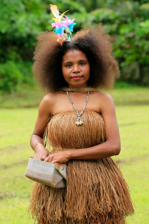 a woman in a grass skirt holding a purse, inspired by Maties Palau Ferré, hurufiyya, with textured hair and skin, one single tribe member, slide show, portrait image