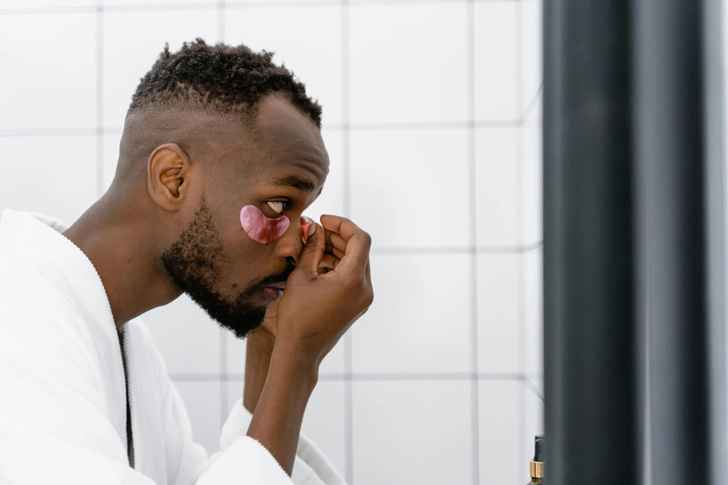 a man brushing his teeth in front of a mirror, inspired by Barthélemy Menn, pexels contest winner, afrofuturism, eye glass, noticeable tear on the cheek, profile image, round goggles