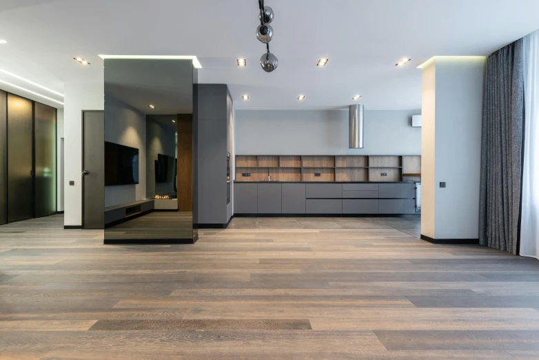 a living room filled with furniture and a flat screen tv, inspired by Albert Paris Gütersloh, unsplash contest winner, light and space, luxury bespoke kitchen design, 3/4 view from below, studio floor, grey