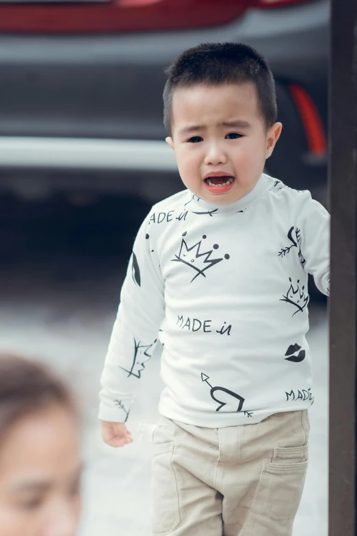 a little boy that is standing in front of a mirror, inspired by Louis Le Nain, pexels contest winner, graffiti, long sleeves, crying, asian male, 2 years old