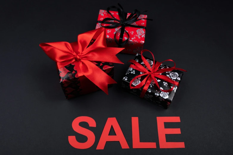 a couple of presents sitting on top of a black table, sales, black and red only, square, thumbnail