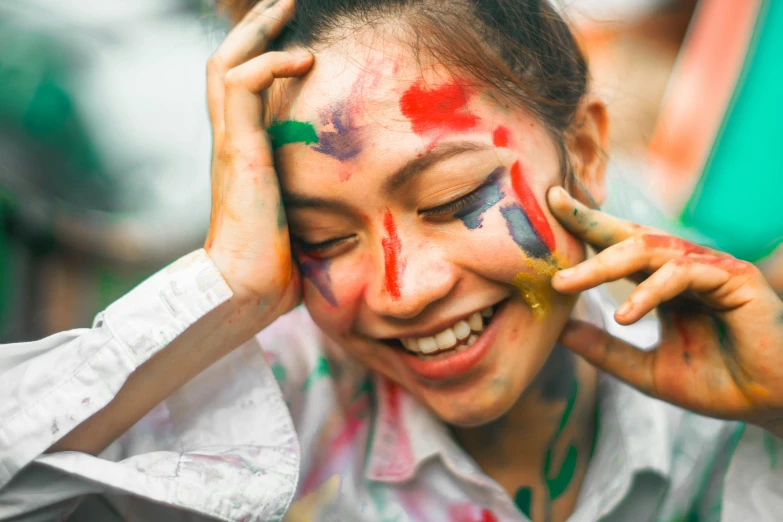 a close up of a person with paint on their face, by Julia Pishtar, trending on unsplash, smiling playfully, vietnamese woman, everyone having fun, color illustration