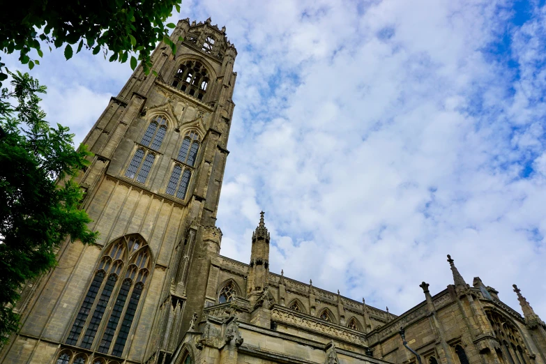 a very tall building with a clock tower, by Rachel Reckitt, pexels contest winner, church cathedral, thumbnail, warwick saint, view from below